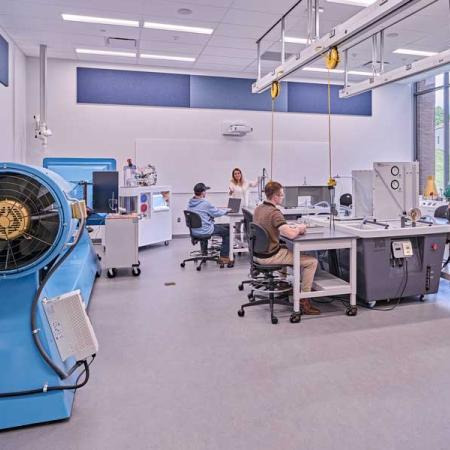 a photo of a lab with students working in it