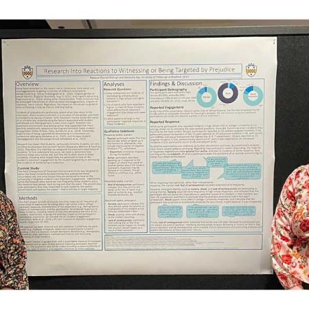 Professor McHugh and a student standing in front of a presentation board