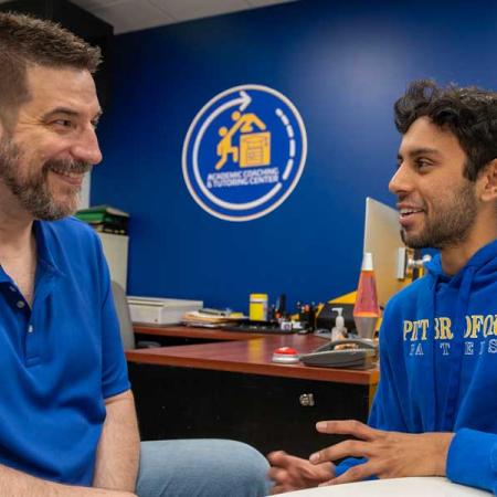 Sai Ten talking to an academic coach