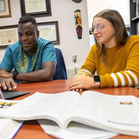 Jonathan Chitiyo with a student