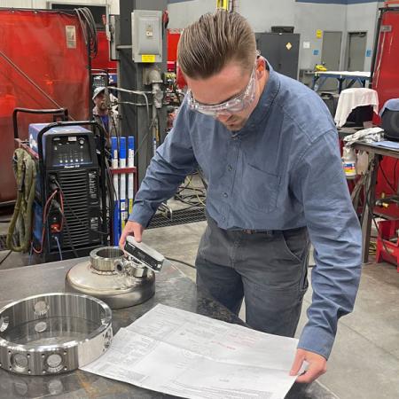 Nick Haner working in a machine shop