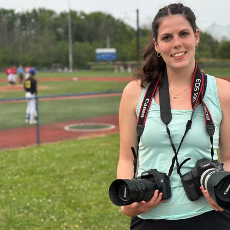 Brooklyn on the field taking photos