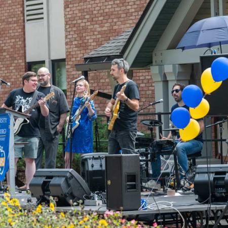 the faculty-staff band "Slick" playing on stage