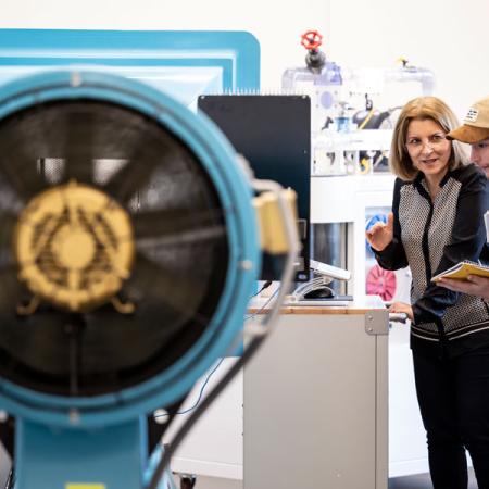 students observing during a lecture with the wind tunnel