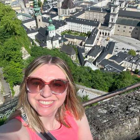 Madison Miller taking a selfie above a town in Europe