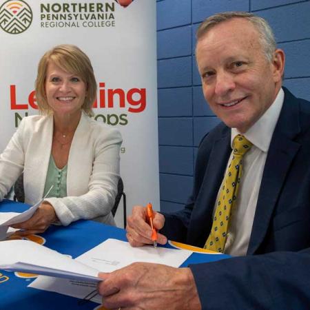 President Rick Esch and the president for NPRC signing the agreement