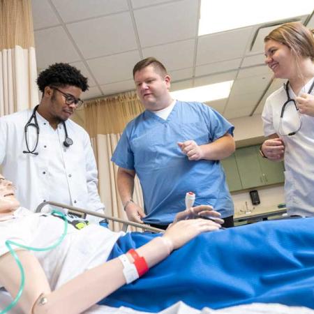 Students practicing nursing techniques