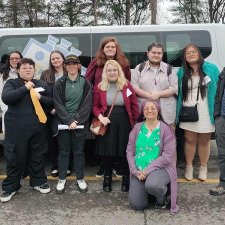 Students and faculty smiling for the photo