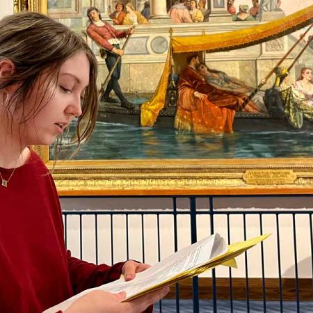 A girl reading a script for a play