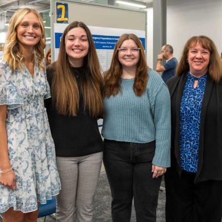 Nursing students with instructor smiling for picture